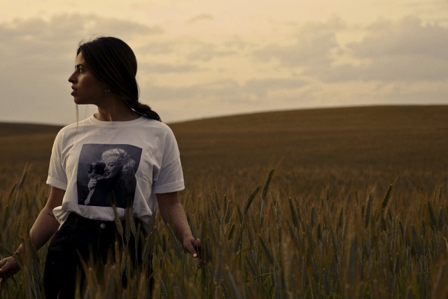 After: Young woman standing in a wheat field at dusk, edited with the free Lutify.me LUTs