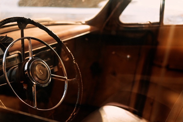 After: Vintage car steering wheel and dashboard in warm light, edited with the free Lutify.me LUTs