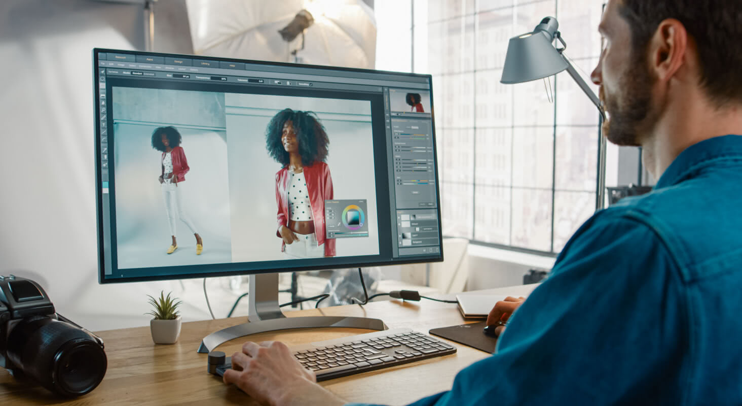 Editor enhancing fashion model images on photo editing software