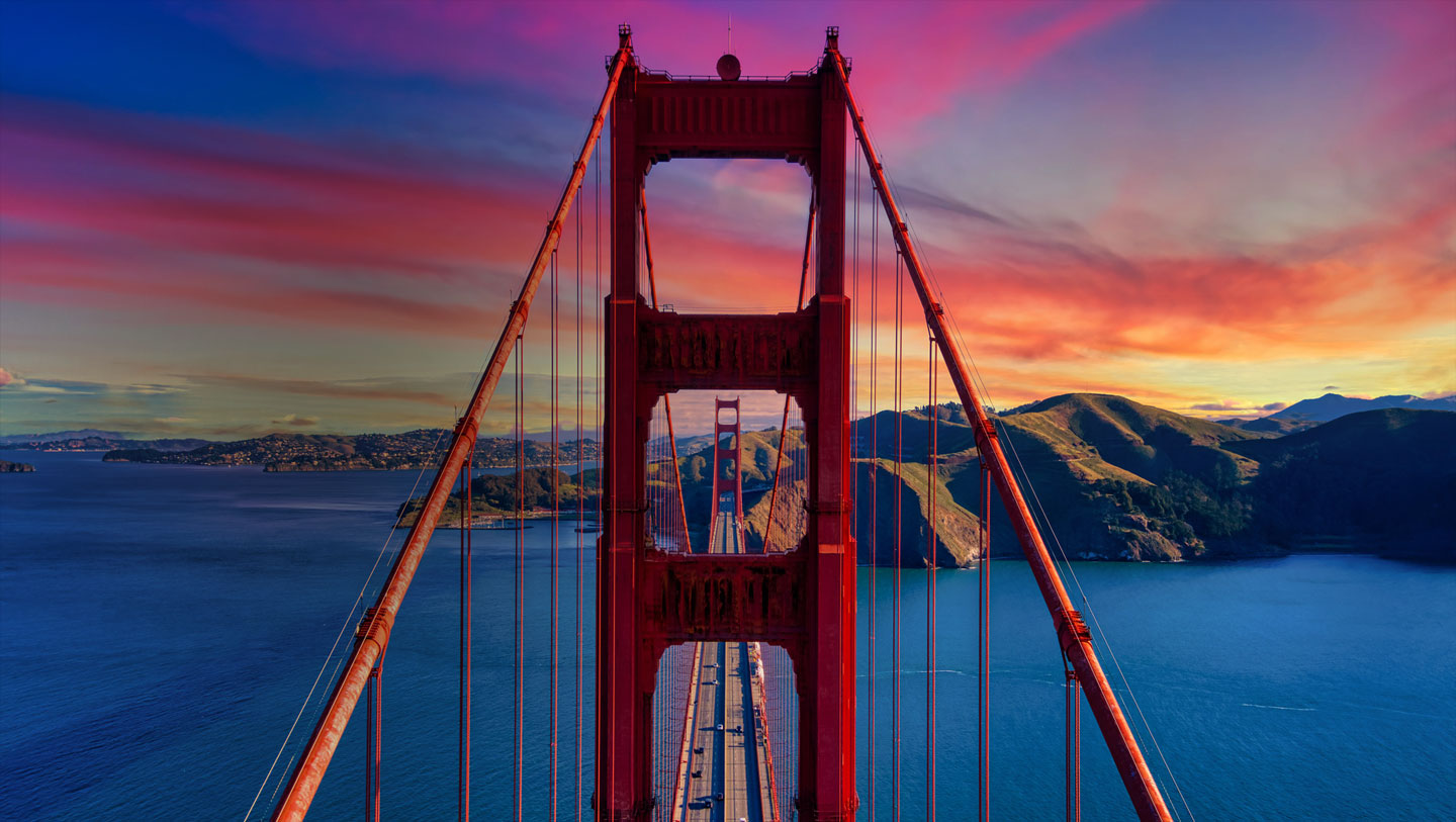 The Golden Gate Bridge under a vivid sunset sky